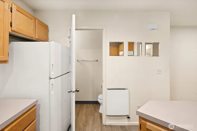 a bathroom with a sink toilet tub and shower