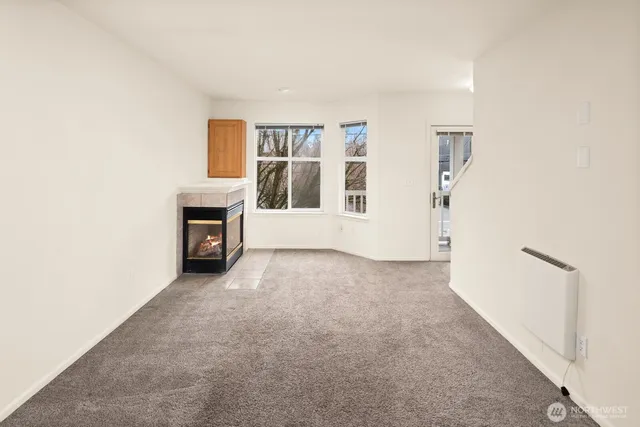 an empty room with a bathroom and a sink