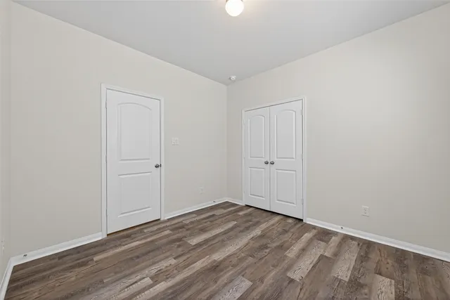 a bathroom with a sink a toilet a mirror and vanity