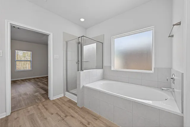 a view of porch with a floor to ceiling window and wooden fence