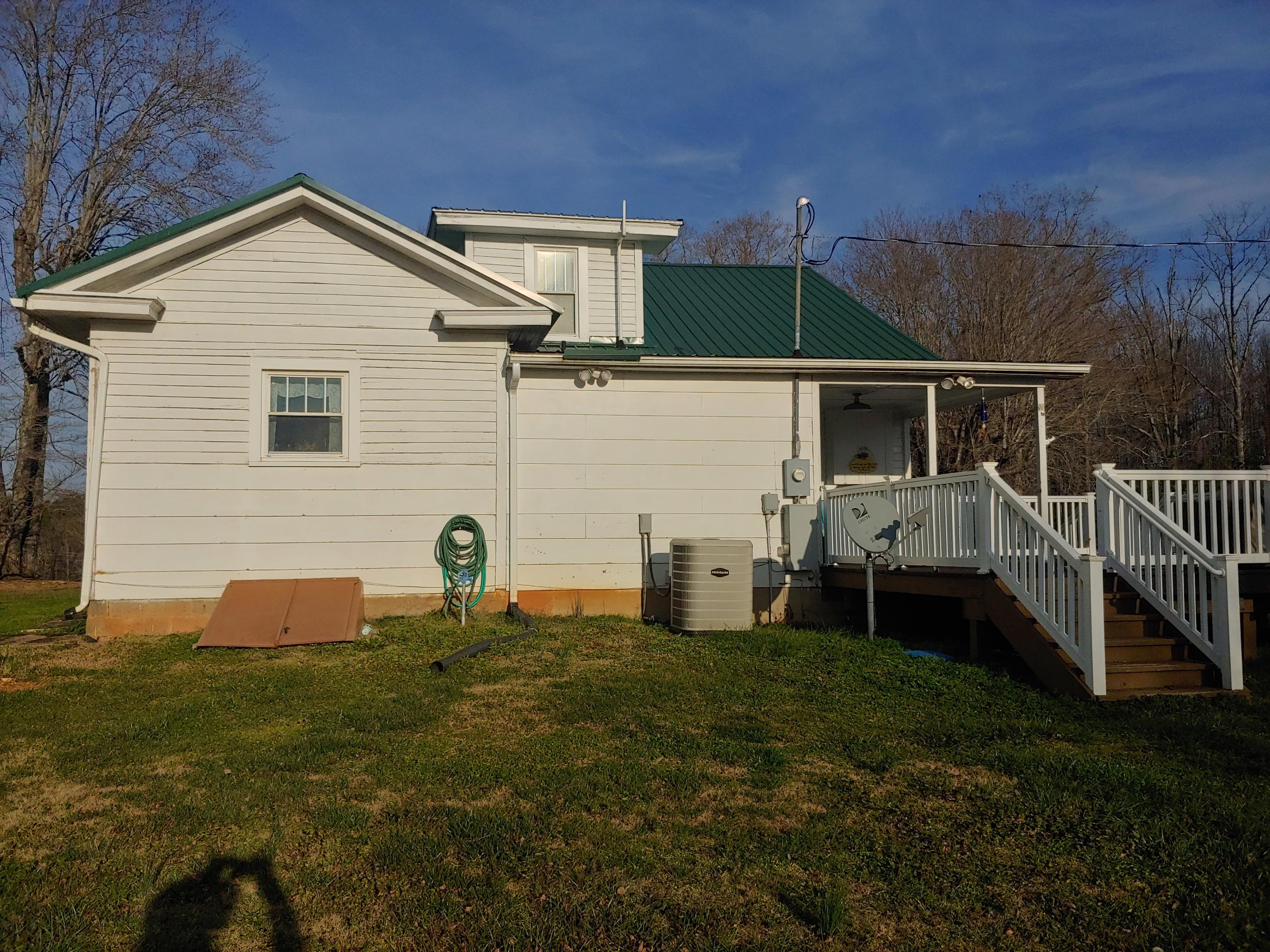 9313 Museville Road Sandy Level, VA 24161 - Photo 18 of 41 a backyard of a house with table and chairs