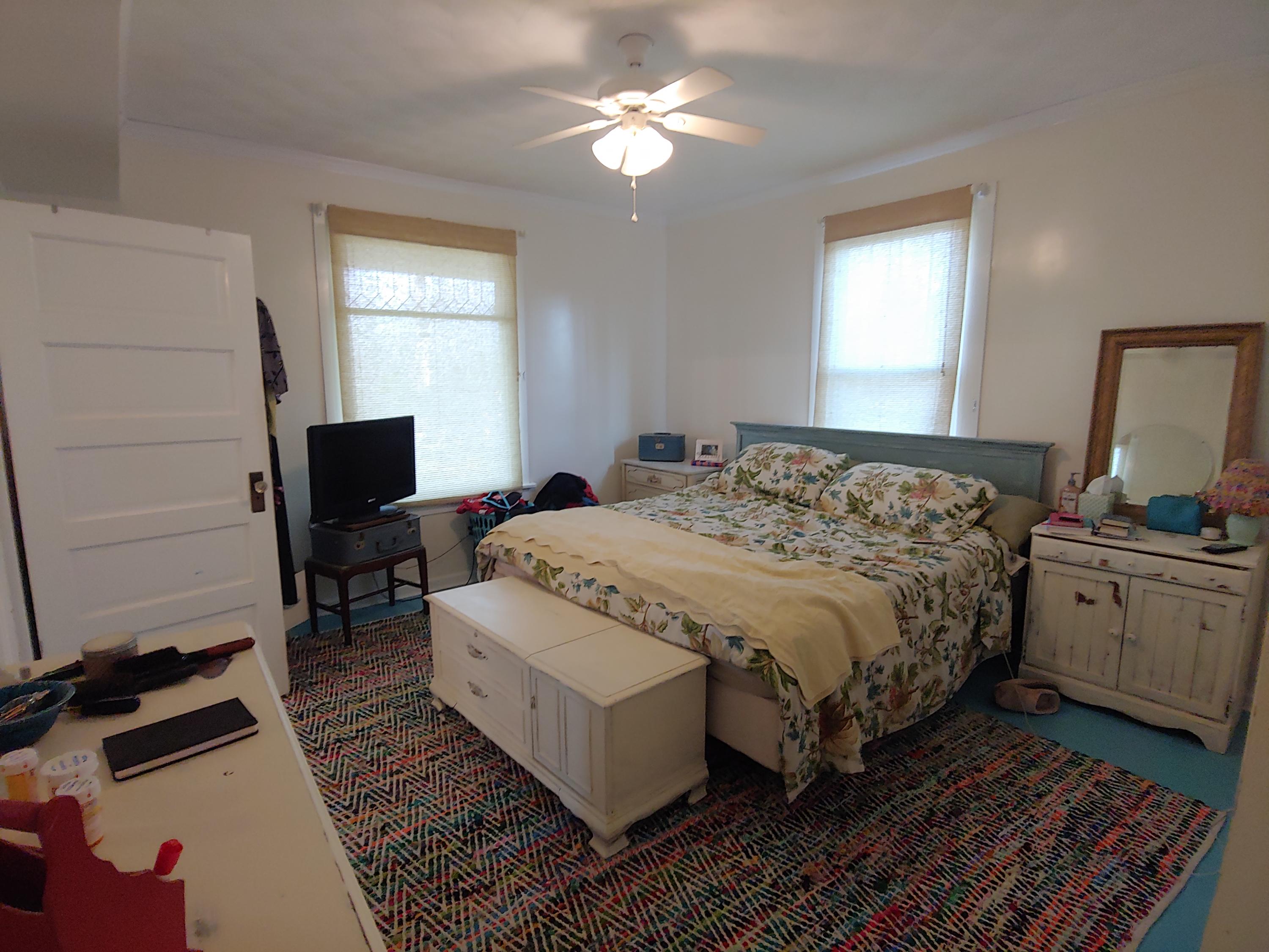 9313 Museville Road Sandy Level, VA 24161 - Photo 32 of 41 a bedroom with a bed and a chandelier