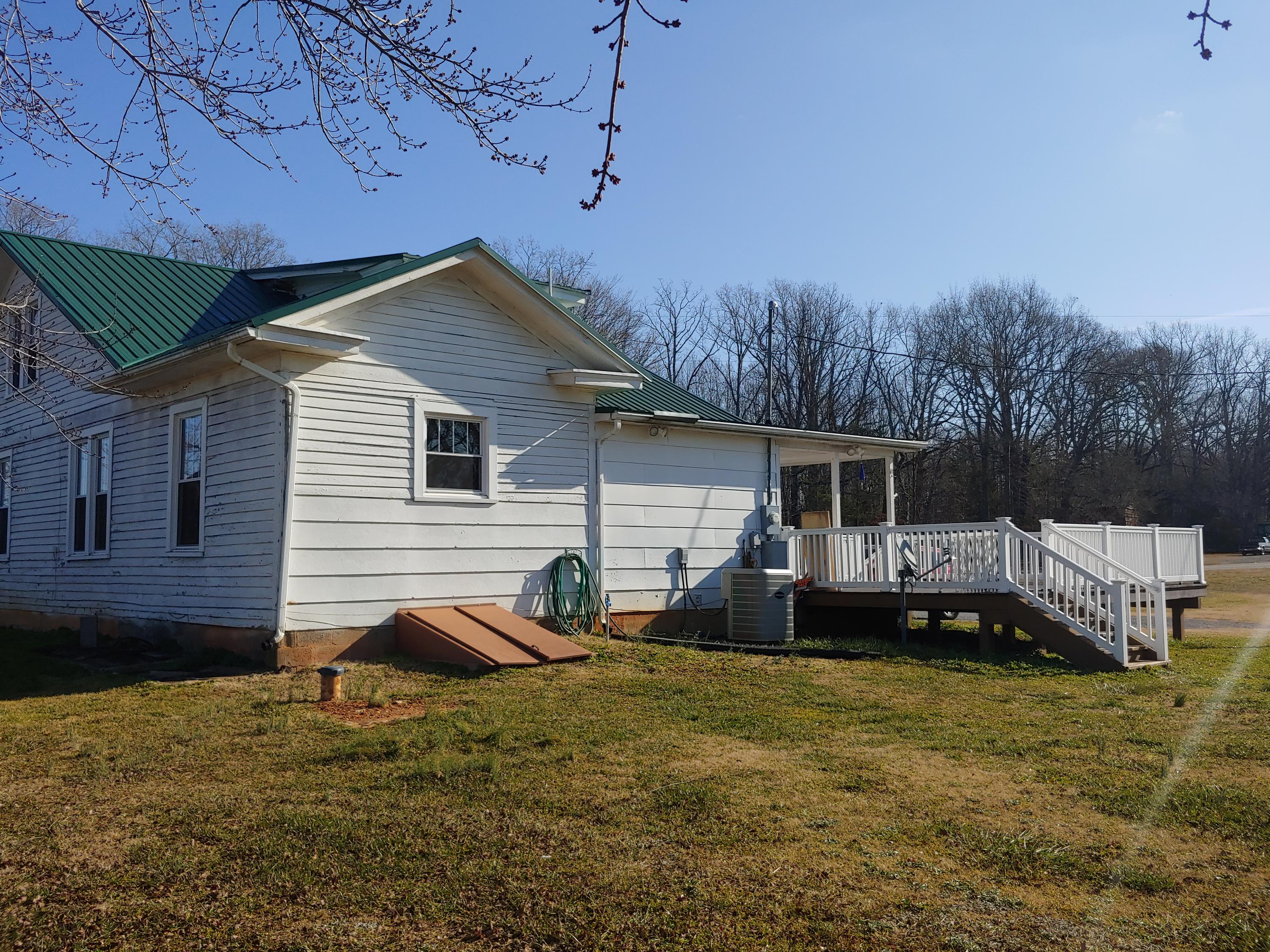 9313 Museville Road Sandy Level, VA 24161 - Photo 34 of 41 a view of house with backyard and seating area