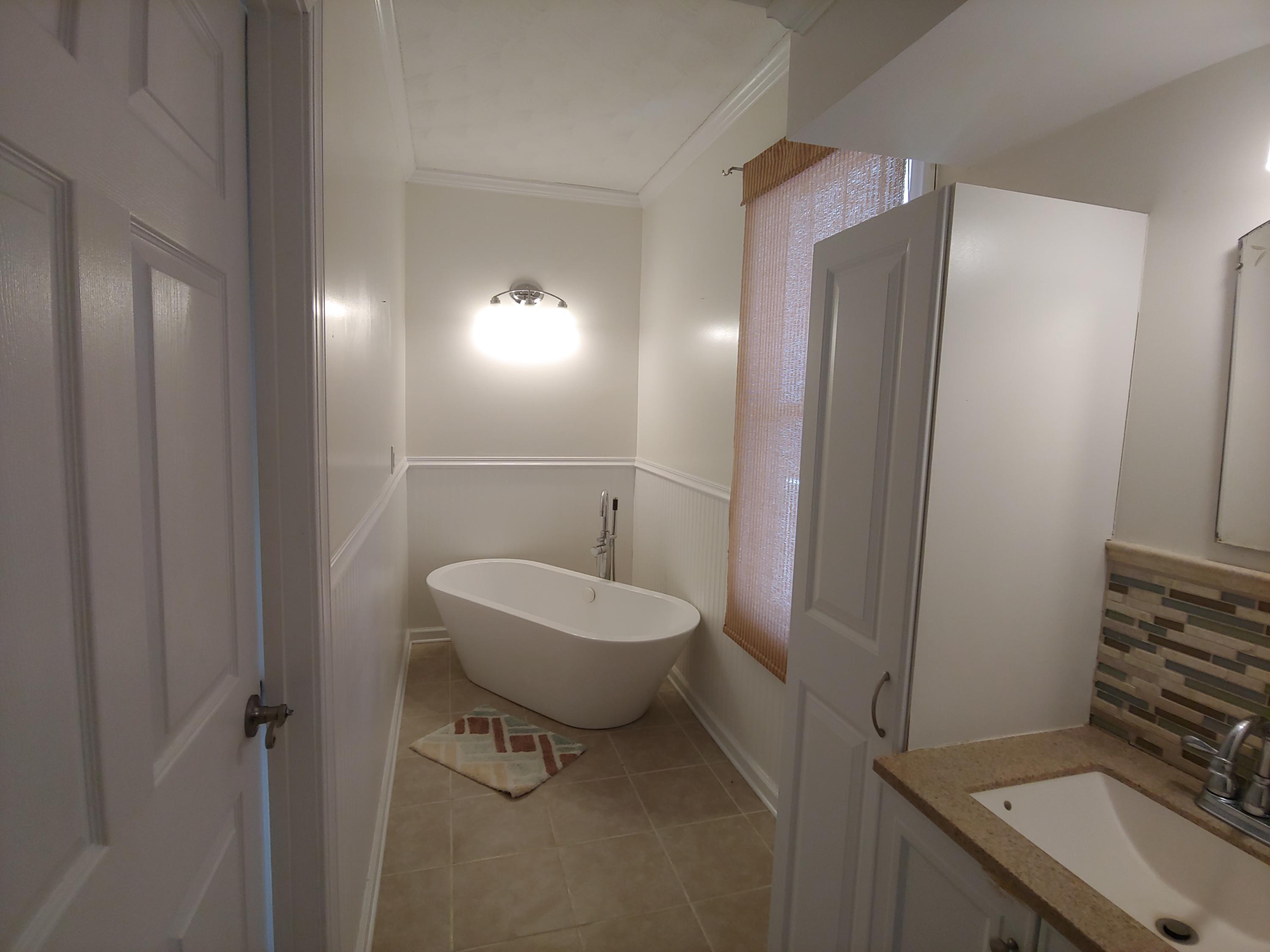 9313 Museville Road Sandy Level, VA 24161 - Photo 10 of 41 a bathroom with a toilet a sink and mirror