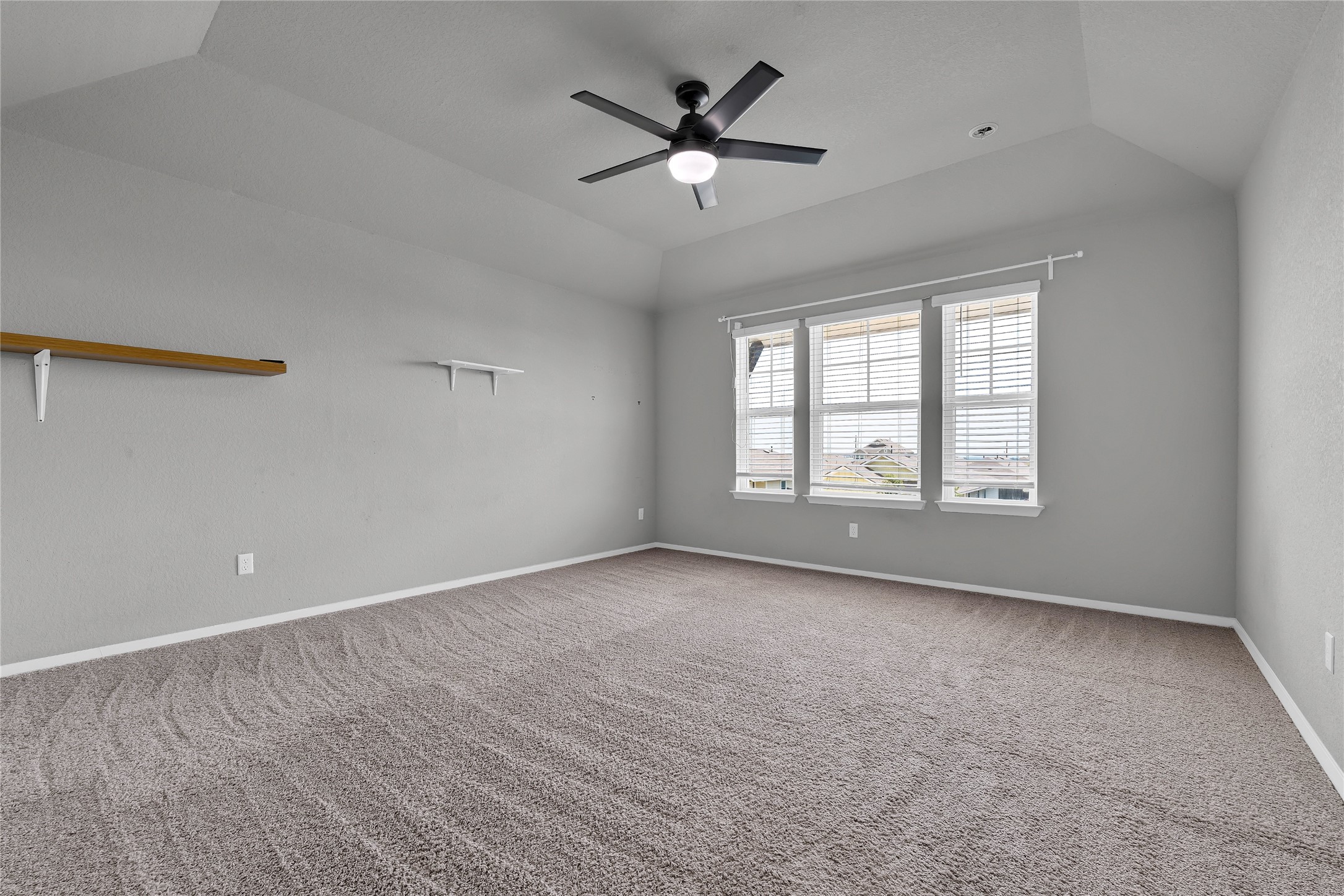 101 Crescent Street Georgetown, TX 78626 - Photo 18 of 39 Primary bedroom with recessed lighting and high ceilings.