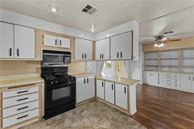 a kitchen with stainless steel appliances granite countertop a stove and a refrigerator