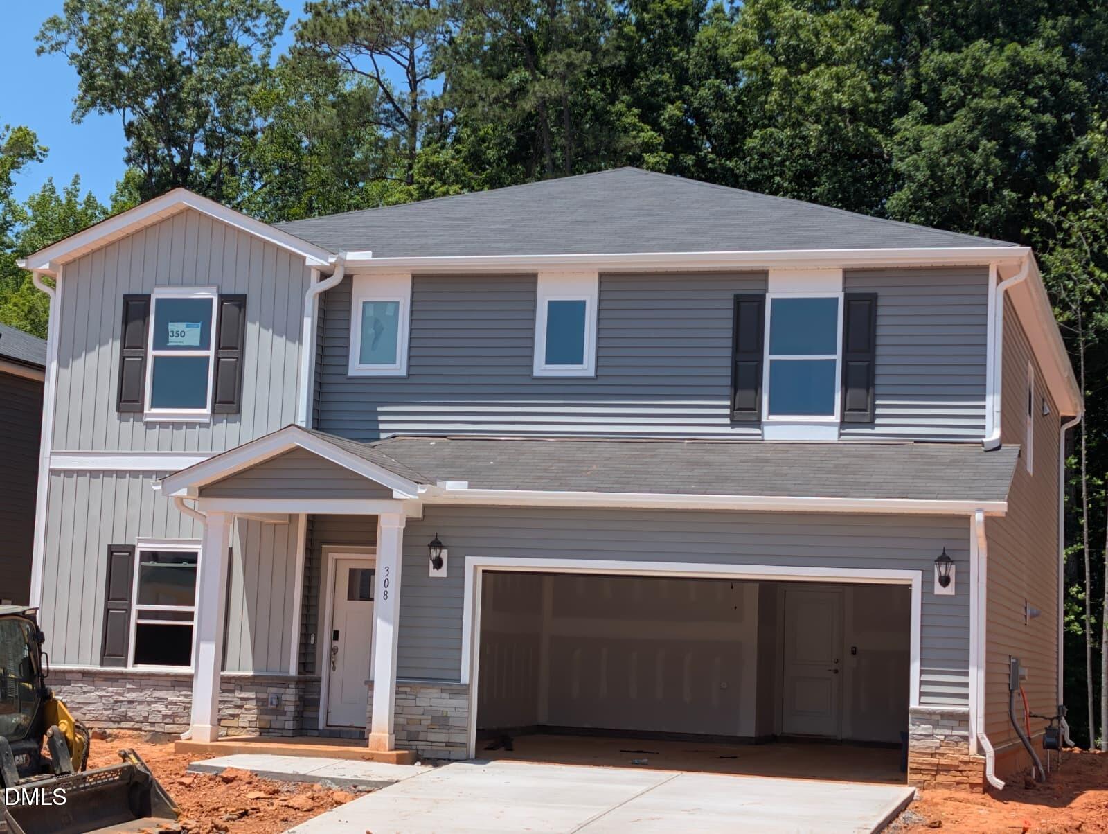 308 Karlov Road Garner, NC 27529 - Photo 3 of 55 a front view of a house with a yard