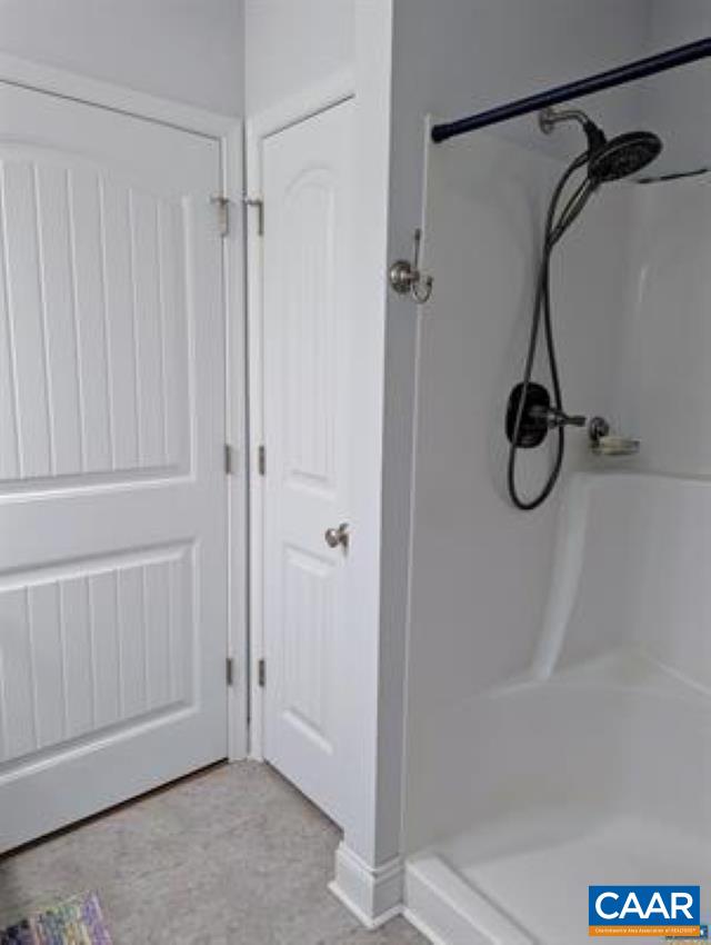 4489 Campbell Road Troy, VA 22974 - Photo 17 of 33 a bathroom with a glass shower door