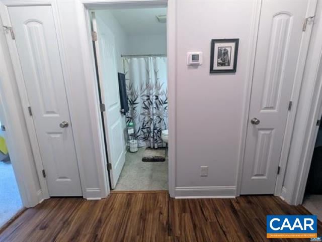 4489 Campbell Road Troy, VA 22974 - Photo 19 of 33 a view of a hallway with wooden floor and stairs