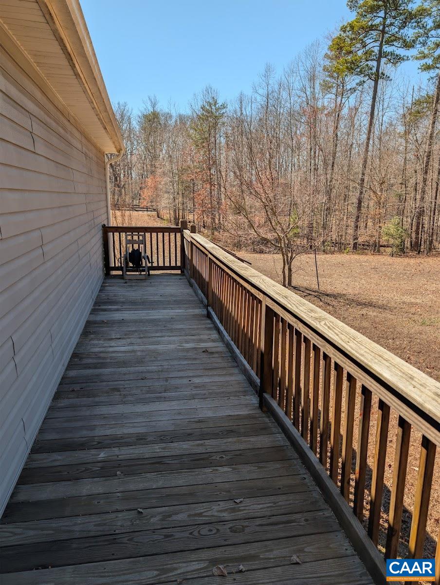 4489 Campbell Road Troy, VA 22974 - Photo 27 of 33 a view of balcony with wooden floor and fence