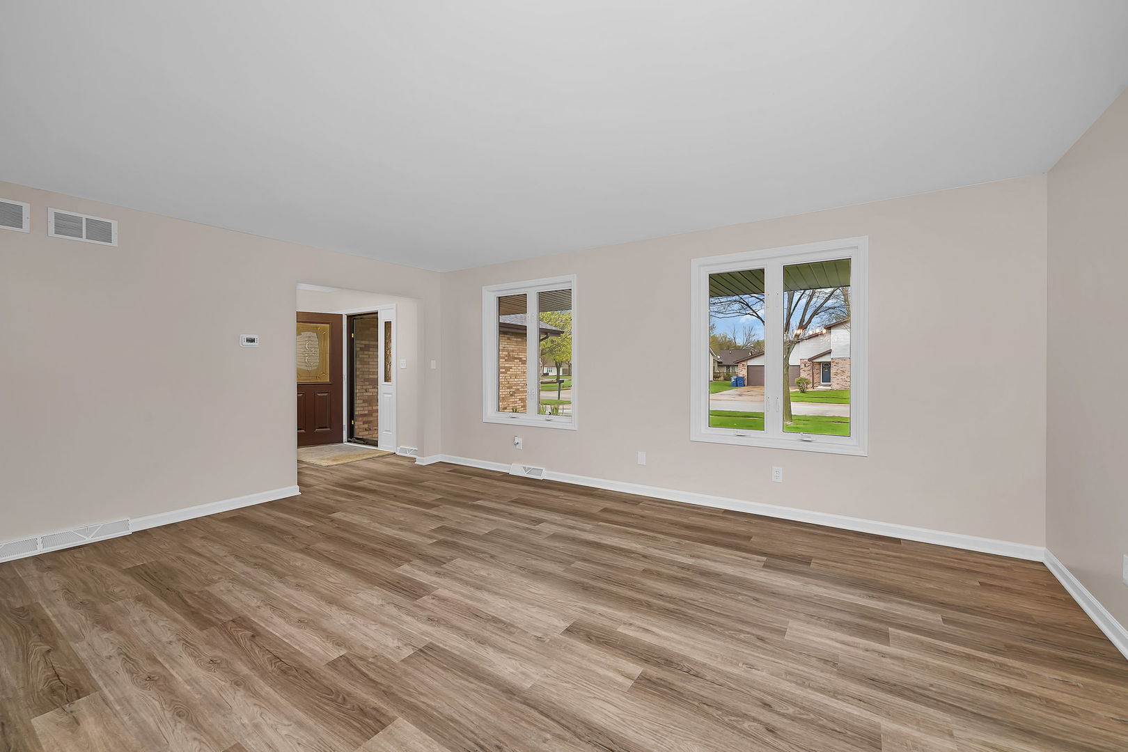 2380 Chestnut Lane Morris, IL 60450 - Photo 8 of 43 a view of an empty room with wooden floor and a window