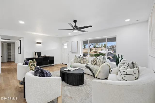 a living room with furniture and a large window