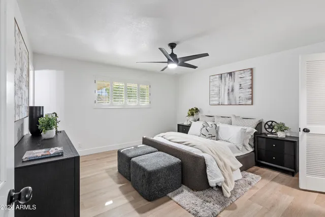a bedroom with a bed furniture and a window