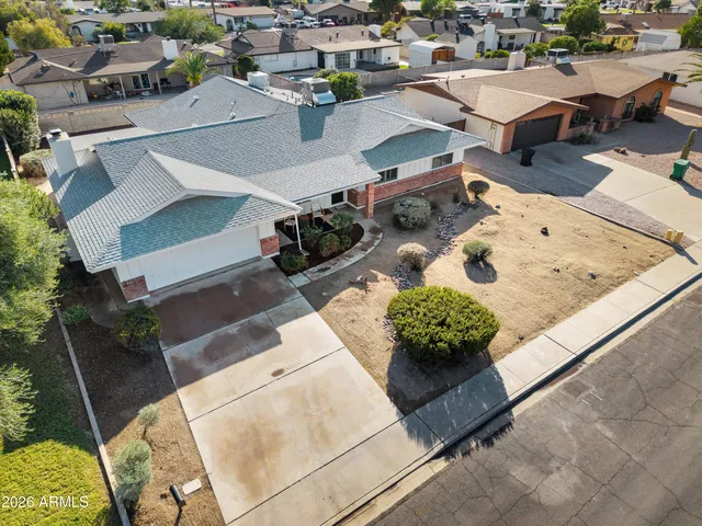 an aerial view of a house with a garden