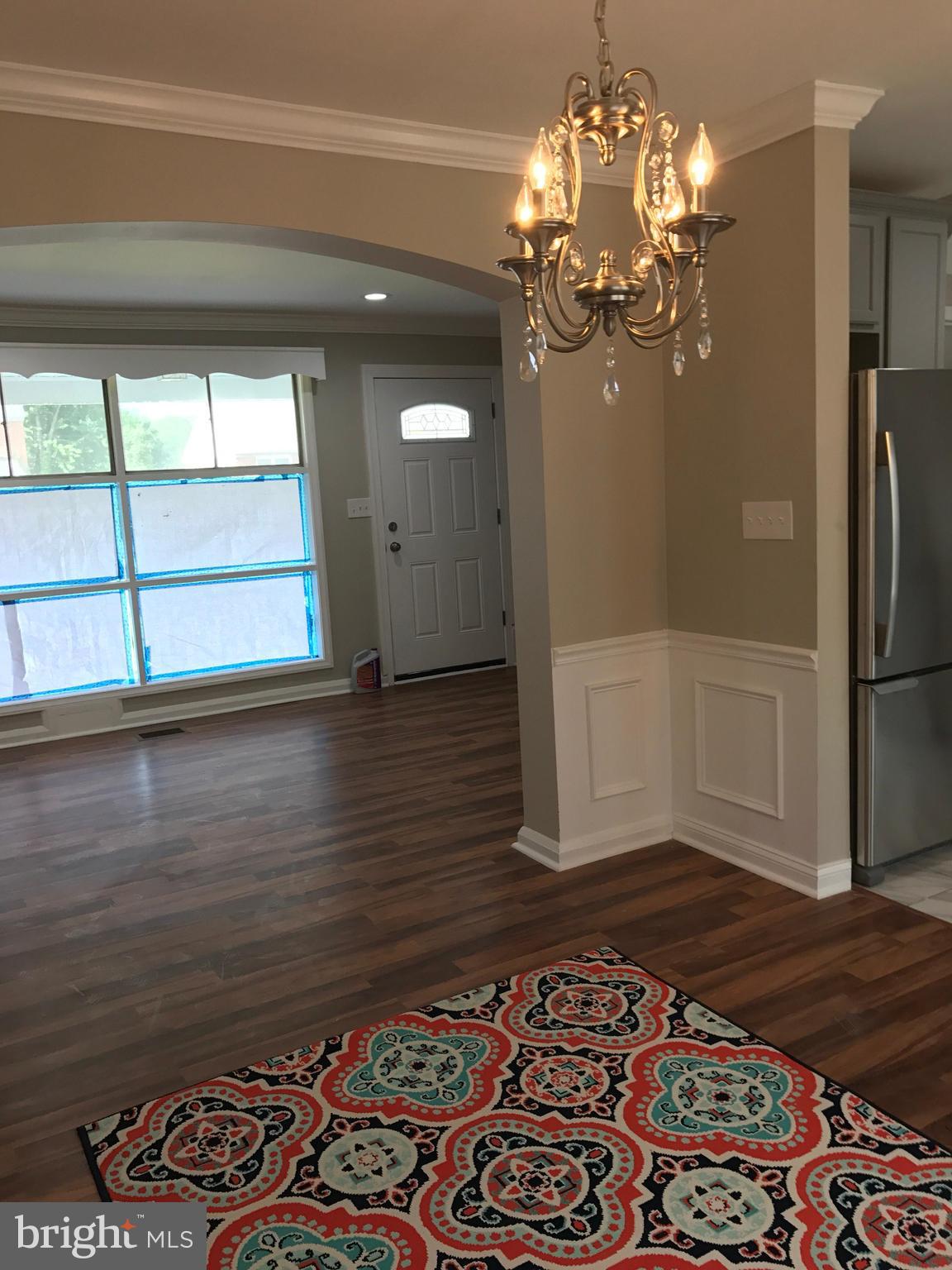 1441 Walker Avenue Baltimore, MD 21239 - Photo 16 of 28 a view of a livingroom with wooden floor
