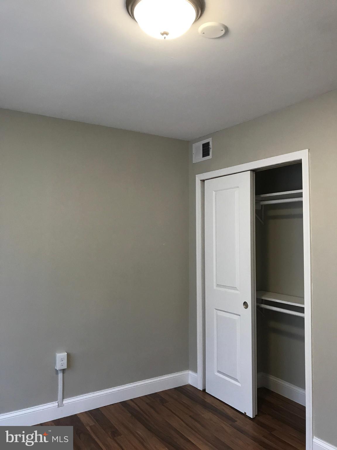 1441 Walker Avenue Baltimore, MD 21239 - Photo 28 of 28 a view of empty room with wooden floor