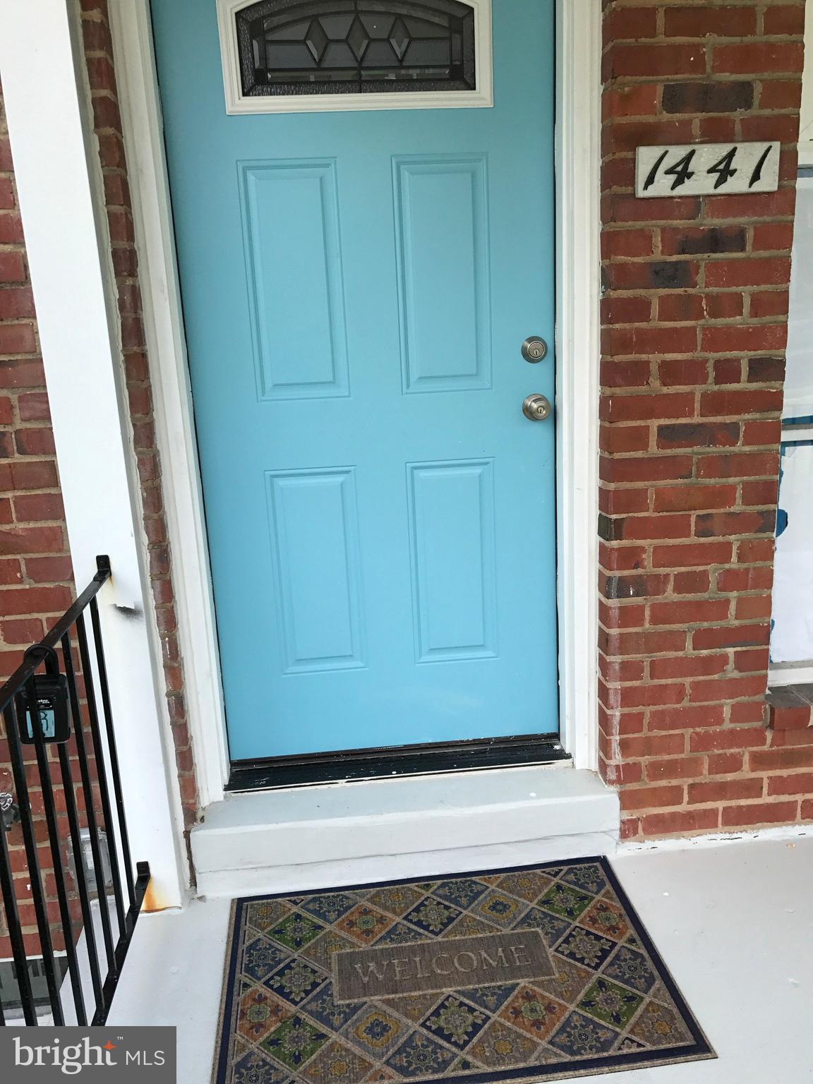 1441 Walker Avenue Baltimore, MD 21239 - Photo 7 of 28 a view of a door and wooden door