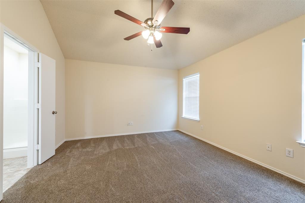 202 Whitestone Way Weatherford, TX 76085 - Photo 15 of 35 an empty room with windows and fan