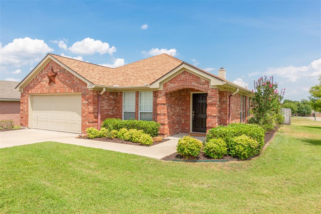 202 Whitestone Way Weatherford, TX 76085 - Photo 2 of 35 a front view of a house with a garden and plants