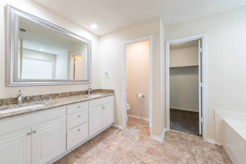 202 Whitestone Way Weatherford, TX 76085 - Photo 18 of 35 a bathroom with a granite countertop sink and a mirror