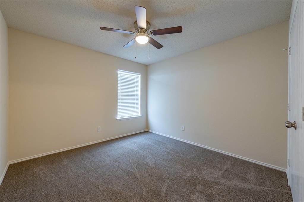 202 Whitestone Way Weatherford, TX 76085 - Photo 20 of 35 an empty room with a window and a fan