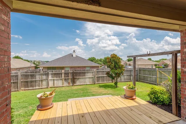 a bathroom with a granite countertop sink a toilet and bathtub