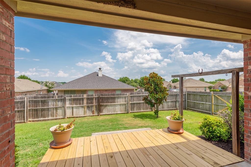 202 Whitestone Way Weatherford, TX 76085 - Photo 25 of 35 a view of a house with a yard