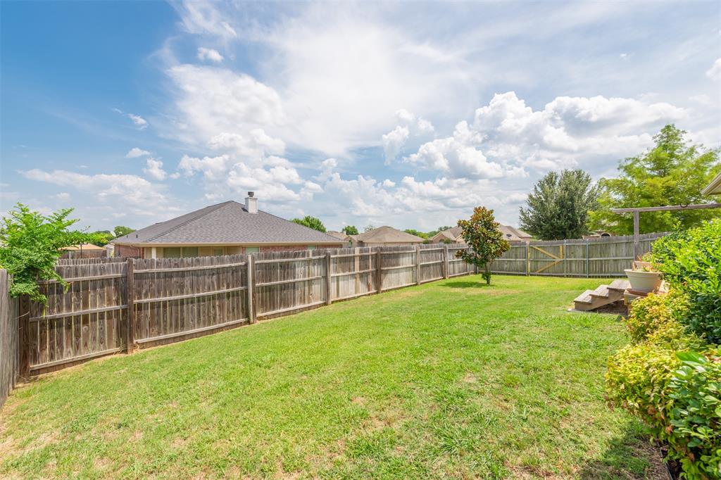 202 Whitestone Way Weatherford, TX 76085 - Photo 27 of 35 a view of a green field with wooden fence