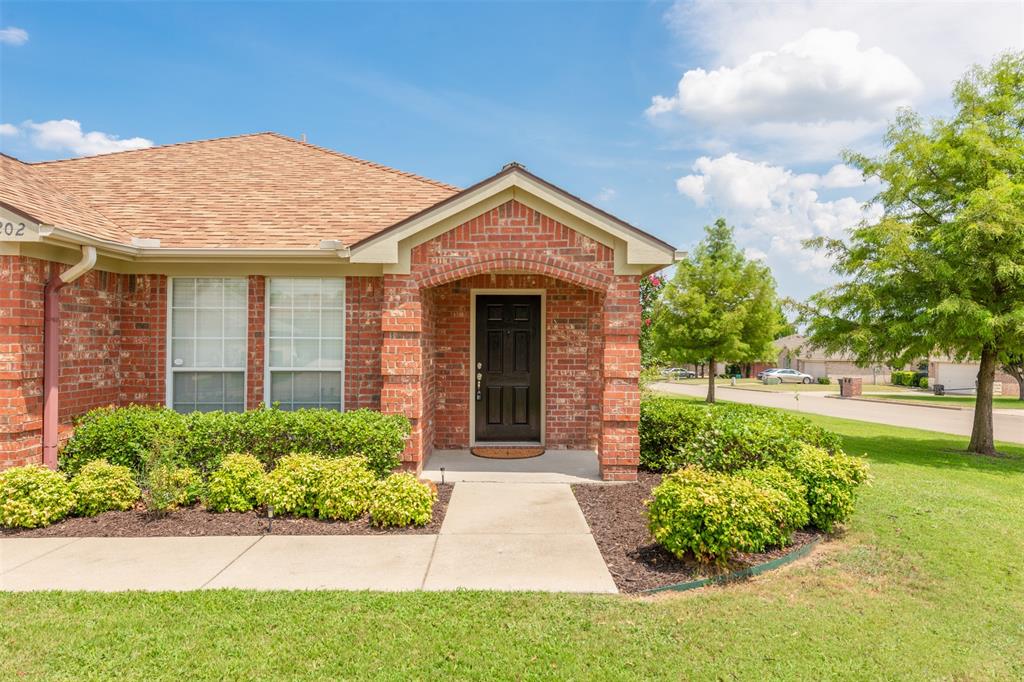 202 Whitestone Way Weatherford, TX 76085 - Photo 3 of 35 a front view of a house with garden