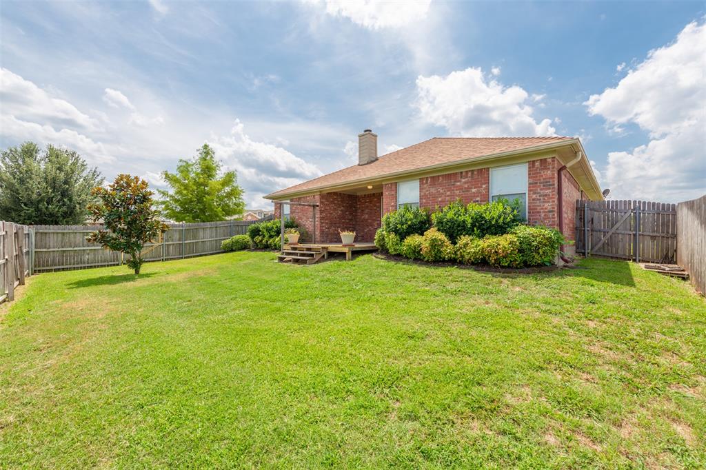 202 Whitestone Way Weatherford, TX 76085 - Photo 28 of 35 a front view of a house with a yard and potted plants