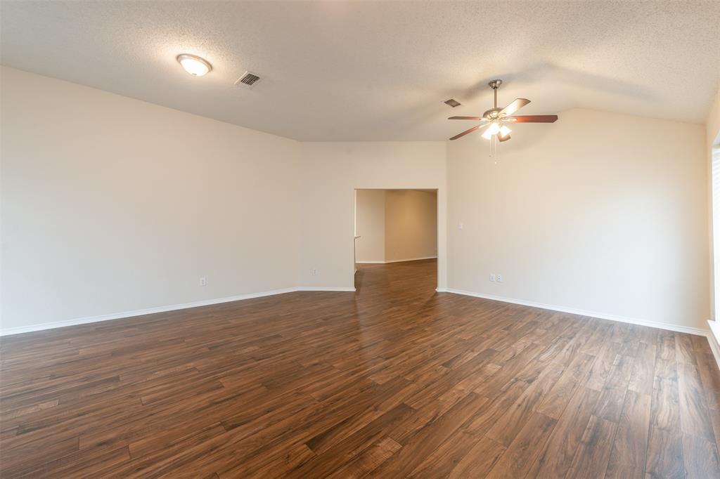 202 Whitestone Way Weatherford, TX 76085 - Photo 6 of 35 a view of empty room with wooden floor