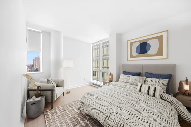 a bedroom with a bed and a couch