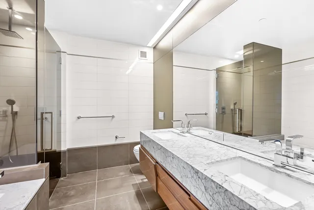 a bathroom with a sink and a shower