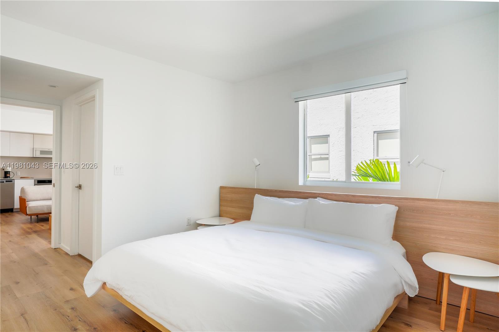 136 Northeast 46th Street, Unit 3 Miami, FL 33137 - Photo 2 of 9 a bedroom with a bed and a window