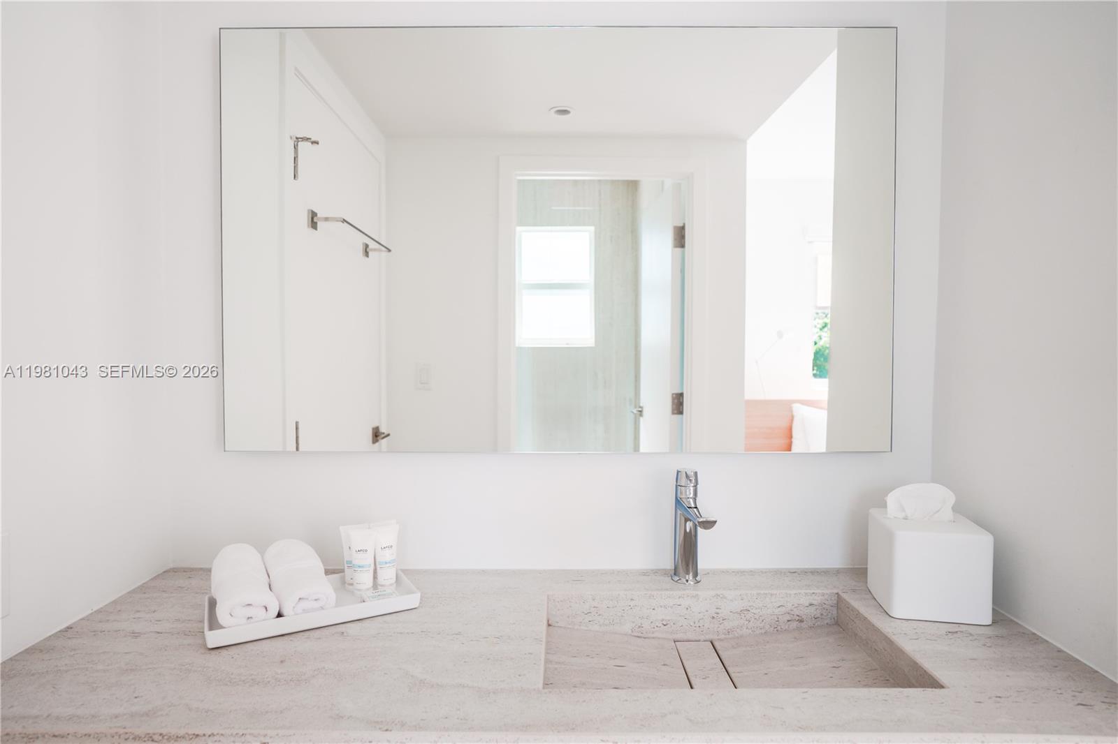 136 Northeast 46th Street, Unit 3 Miami, FL 33137 - Photo 9 of 9 a bathroom with a bathtub and a window
