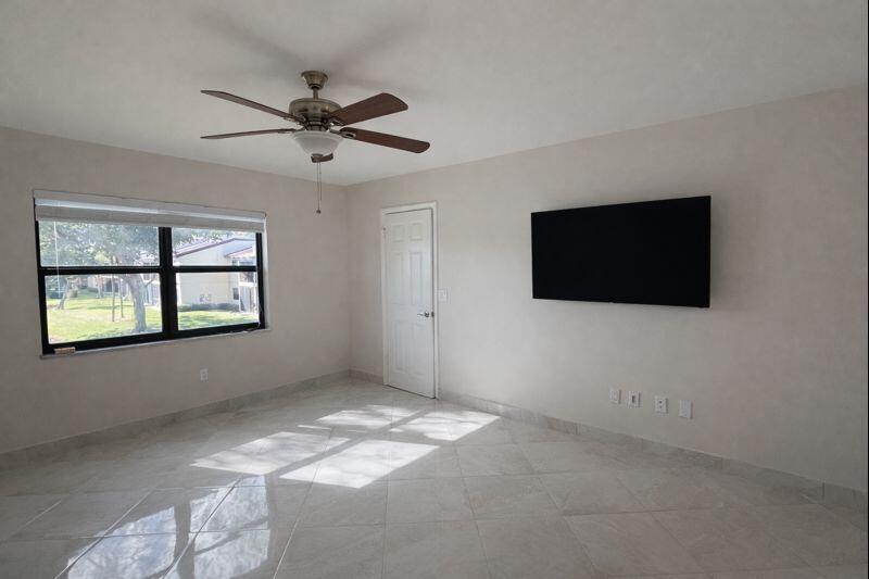 21851 Arriba Real, Unit L Boca Raton, FL 33433 - Photo 13 of 26 a view of a livingroom with a flat screen tv