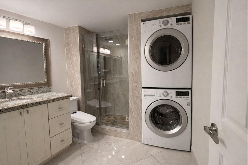 21851 Arriba Real, Unit L Boca Raton, FL 33433 - Photo 20 of 26 a utility room with sink dryer and washer