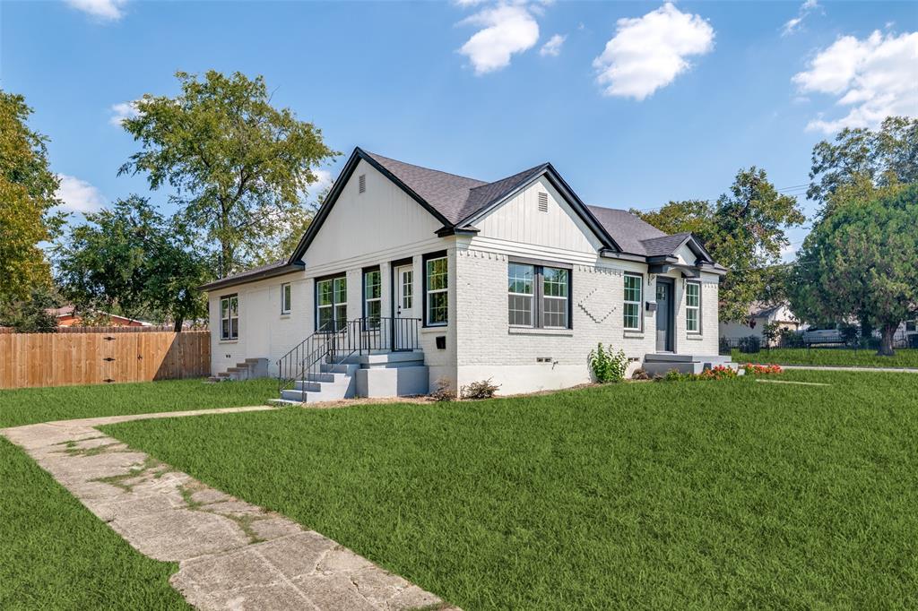 718 Grandview Avenue Dallas, TX 75223 - Photo 3 of 26 a front view of a house with a garden and trees