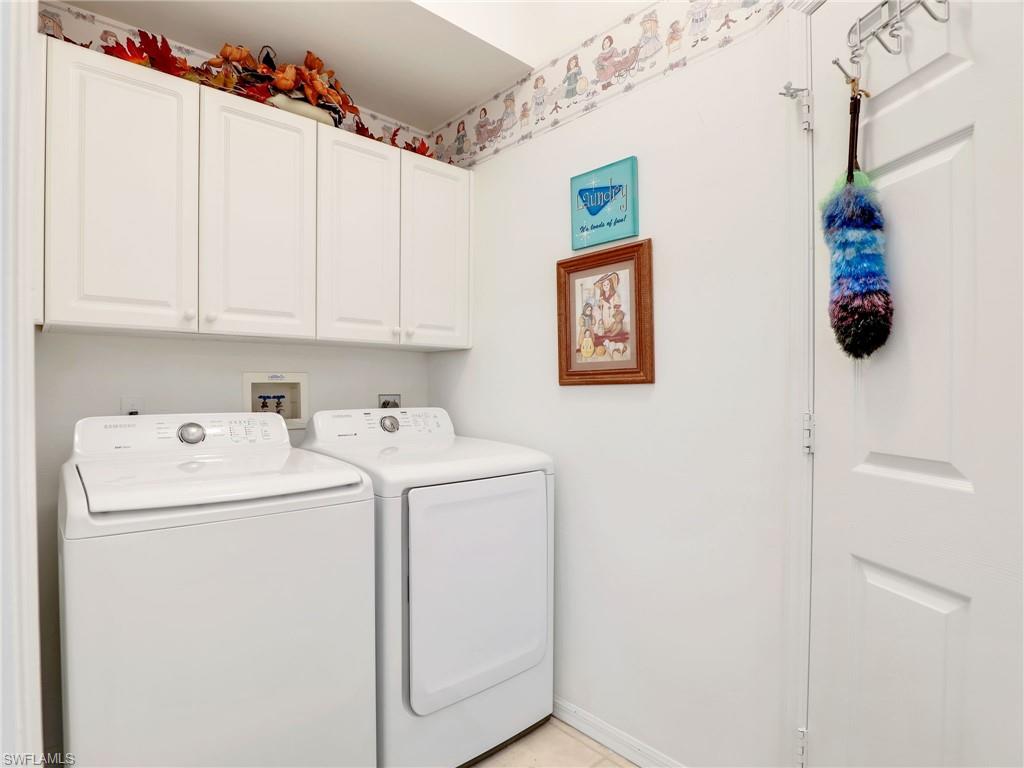 586 Crossfield Circle Naples, FL 34104 - Photo 31 of 38 a utility room with dryer and washer