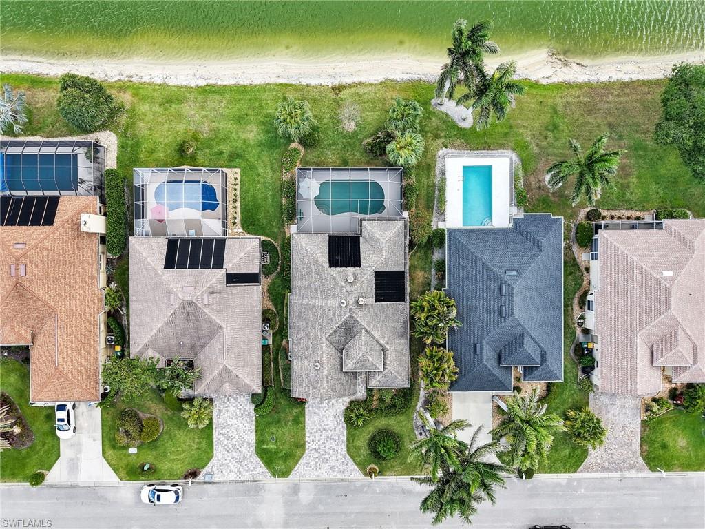 586 Crossfield Circle Naples, FL 34104 - Photo 35 of 38 an aerial view of a house with a garden and plants