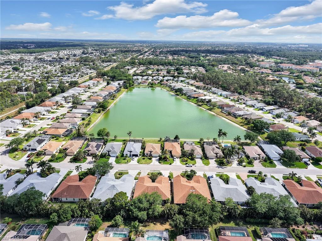 586 Crossfield Circle Naples, FL 34104 - Photo 36 of 38 an aerial view of residential houses with outdoor space