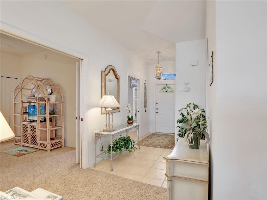 586 Crossfield Circle Naples, FL 34104 - Photo 8 of 38 a living room with furniture