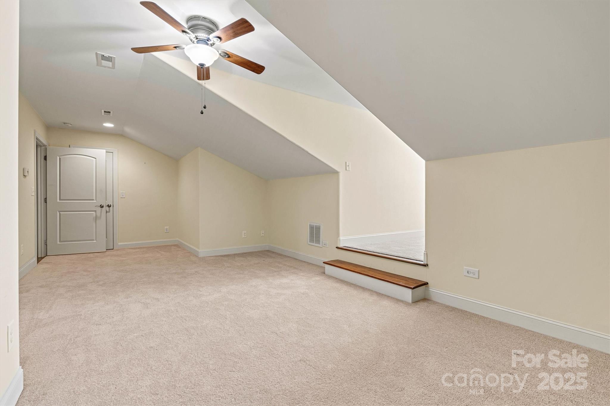 2369 Stardust Court Denver, NC 28037 - Photo 23 of 42 an empty room with a ceiling fan and a window