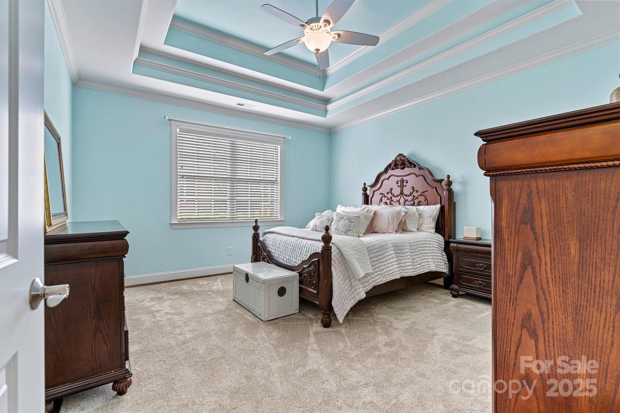 2369 Stardust Court Denver, NC 28037 - Photo 25 of 42 a spacious bedroom with a bed and a chandelier