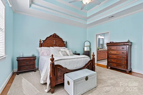a living room with furniture and a ceiling fan