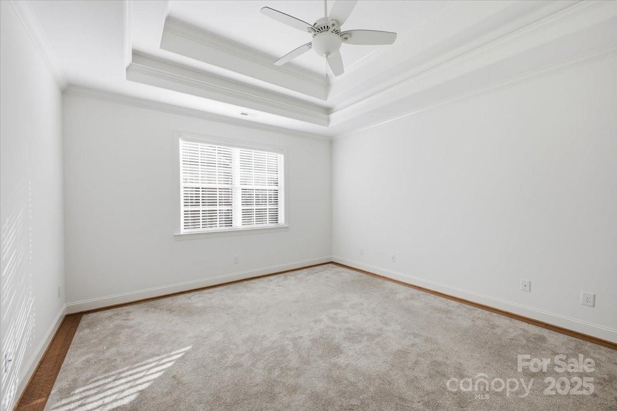 2369 Stardust Court Denver, NC 28037 - Photo 26 of 47 an empty room with a window and a ceiling fan