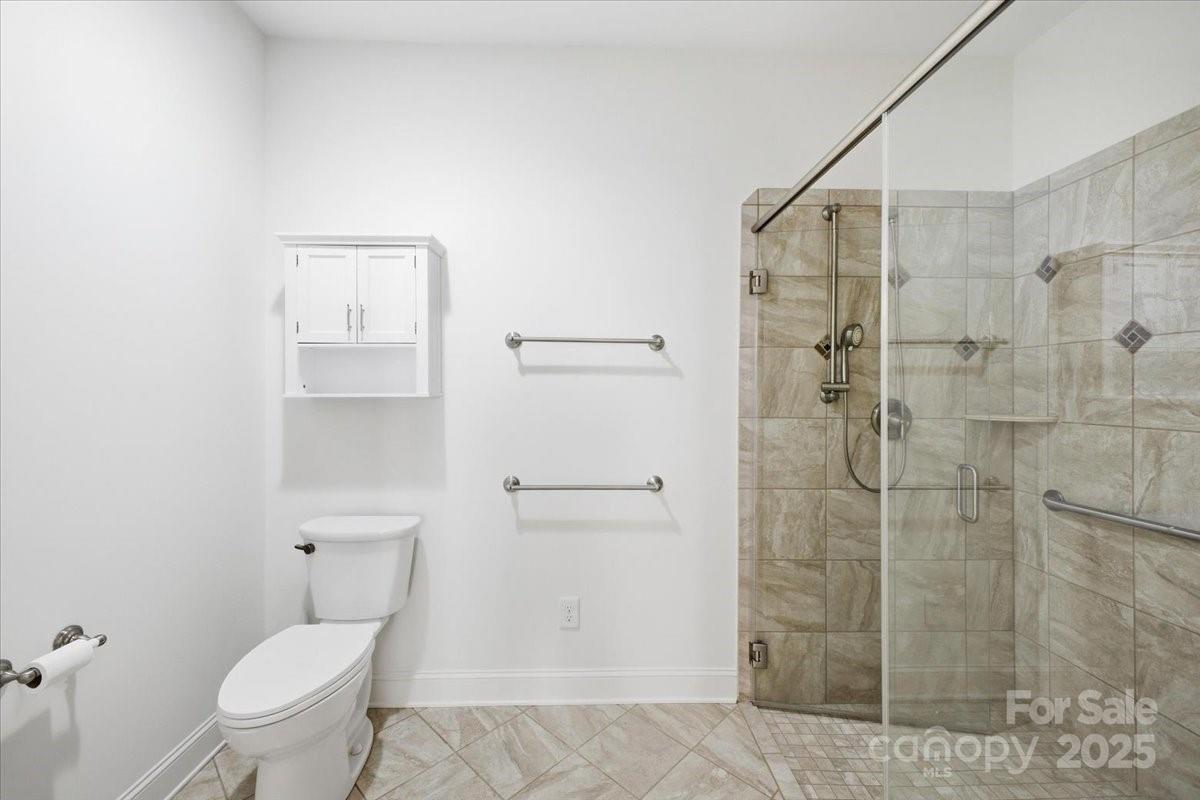 2369 Stardust Court Denver, NC 28037 - Photo 31 of 47 a bathroom with a toilet and a shower
