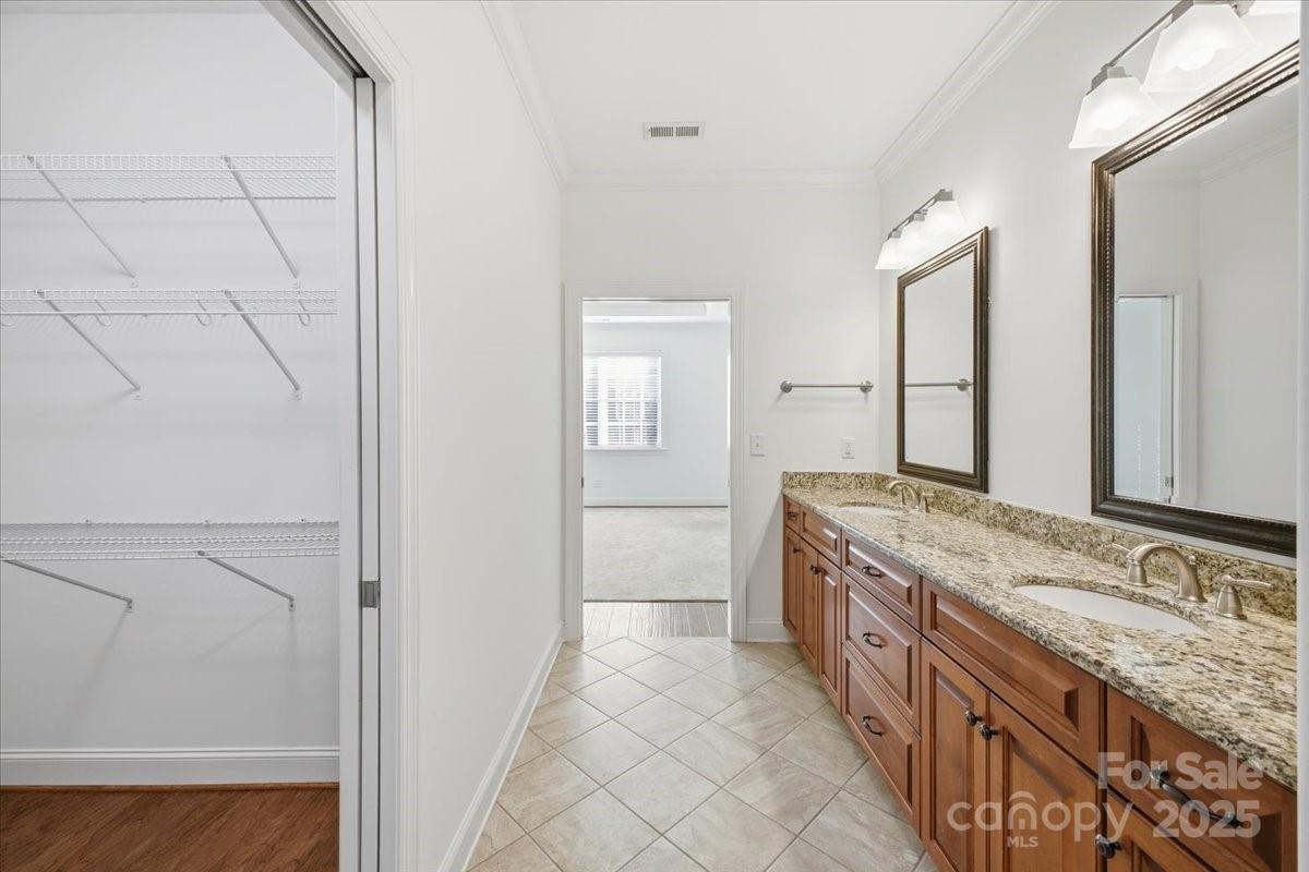 2369 Stardust Court Denver, NC 28037 - Photo 33 of 47 a bathroom with a granite countertop double vanity and a mirror