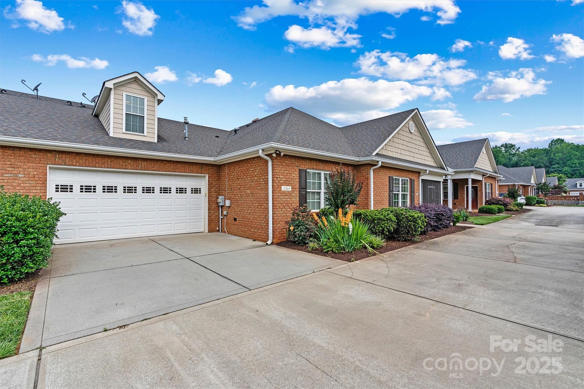 2369 Stardust Court Denver, NC 28037 - Photo 5 of 42 a front view of a house with a yard and garage