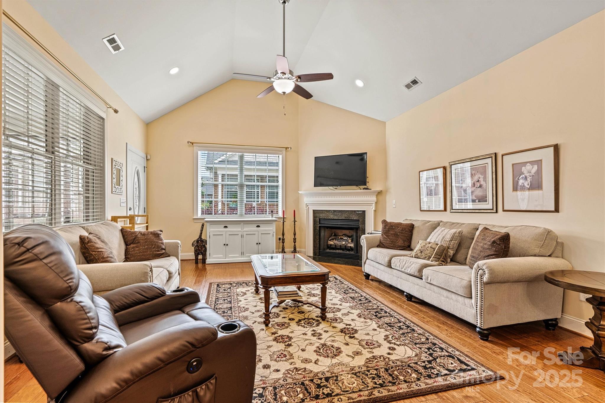 2369 Stardust Court Denver, NC 28037 - Photo 10 of 42 a living room with furniture and a fireplace